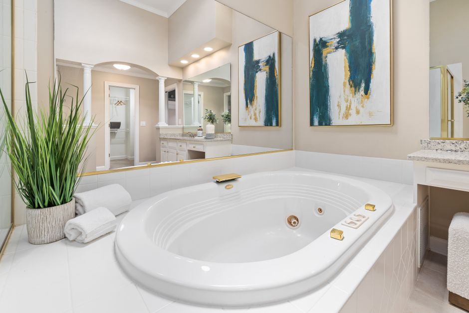 Elegant primary bathroom connected to a bedroom, the kind of space where an odorless toilet keeps air fresh
